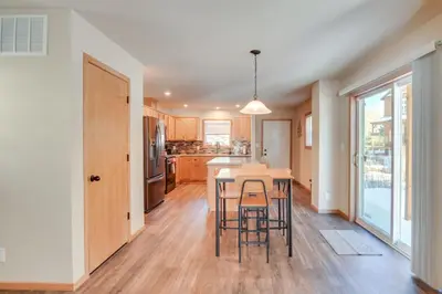 a kitchen with a table and chairs in a room at 4 Mi to Granby Ranch Cabin with Hot Tub Access! in Granby