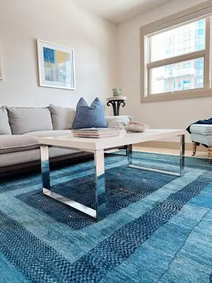 a coffee table in a living room with a couch at 1 bed apartment with parking - Denver Museum District Walk to Convention Center, Capital, museums and shops in Denver