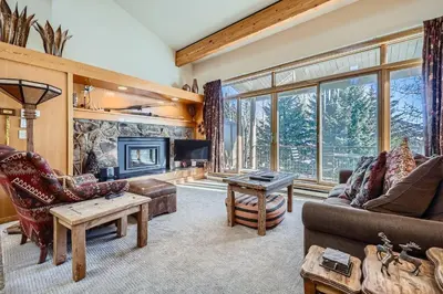 a living room with a couch and a fireplace at 2017 Lodgepole condo in Keystone