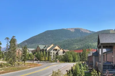 a street in a town with a mountain in the background at Luxury Home - Sleeps 10 - Fireplace & Mountain View condo in Keystone