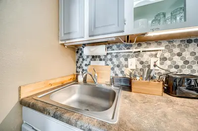 a kitchen with a stainless steel sink in a kitchen at 2 Mi to Granby Ranch Mtn-View Studio with Perks in Granby