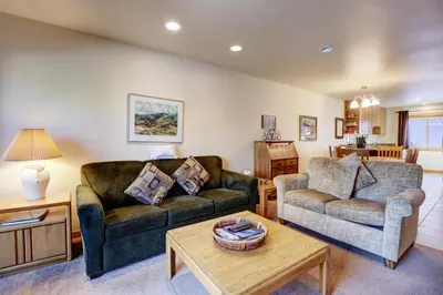 a living room with two couches and a coffee table at 727B Meadow Creek townhouse in Frisco