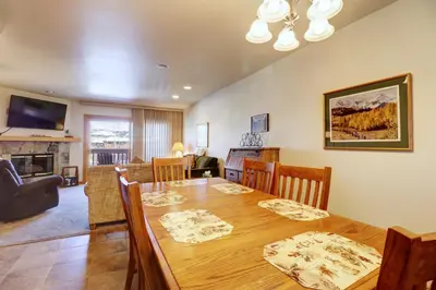 a dining room and living room with a table and chairs at 727B Meadow Creek townhouse in Frisco