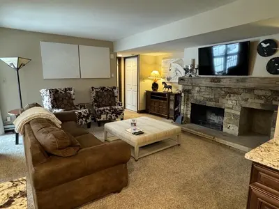 a living room with a couch and a fireplace at Beautiful Renovated 3BR in Keystone condo in Keystone