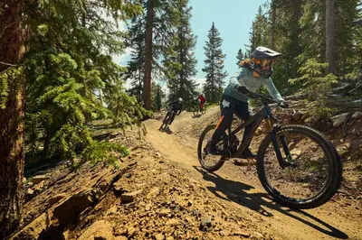 a group of people riding bikes on a dirt trail at Beautiful Renovated 3BR in Keystone condo in Keystone