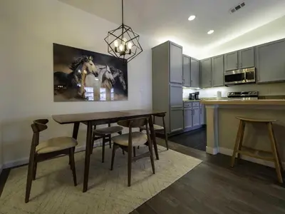 a kitchen with a table and chairs in a kitchen at Aspen Meadows C-302, 0013 in Granby