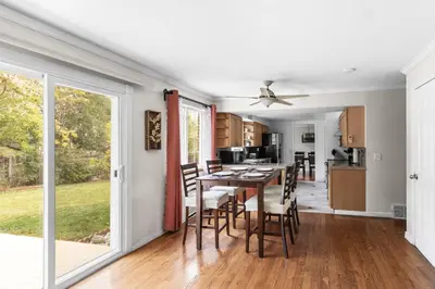 a kitchen and dining room with a table and chairs at Cozy Central Aurora Home in Aurora