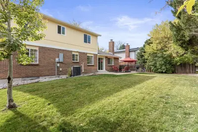 an image of a house with a yard at Cozy Central Aurora Home in Aurora