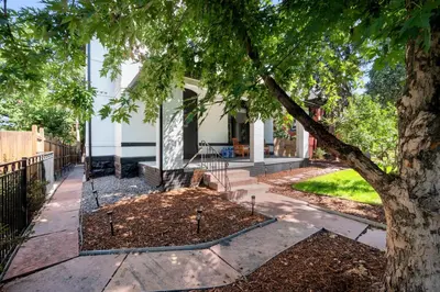a tree in front of a house at Downtown Stay off Broadway Nightlife Nearby Parking in Denver