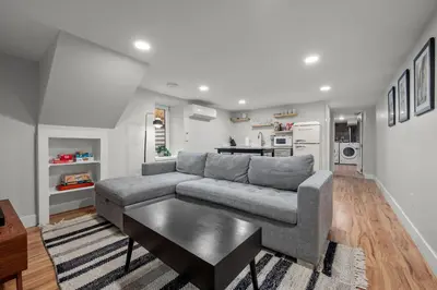 a living room with a couch and a table at Downtown Stay off Broadway Nightlife Nearby Parking in Denver
