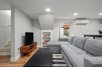 a living room with a couch and a tv at Downtown Stay off Broadway Nightlife Nearby Parking in Denver
