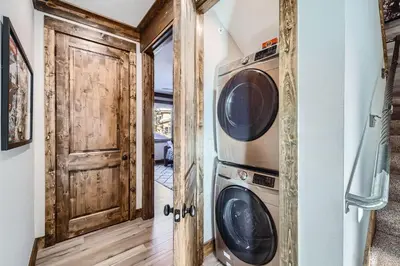 a laundry room with two washer and dryer at 1890 The Seasons townhouse in Dillon