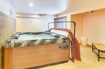 a hospital room with a bed in the corner at Walk to Winter Park Resort Condo with Hot Tub! in Winter Park
