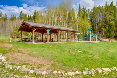 a pavilion with a playground in a park at Pool and 3 Hot Tubs Winter Park Condo on Bus Line in Winter Park