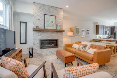 a living room with a couch and a fireplace at Hot Tub and Views Getaway 8 Mi to Keystone Resort! in Silverthorne