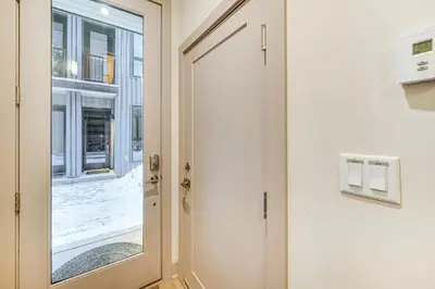 a door in a room with a window at Hot Tub and Views Getaway 8 Mi to Keystone Resort! in Silverthorne