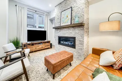 a living room with a couch and a fireplace at Hot Tub and Views Getaway 8 Mi to Keystone Resort! in Silverthorne
