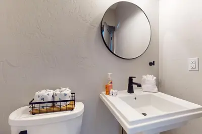 a bathroom with a white sink and a mirror at Mountain Bliss Retreat in Granby in Granby