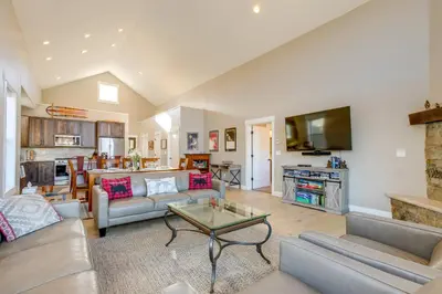 a living room with a couch and a table at 5 Mi to Winter Park Resort Fraser Family Home in Fraser
