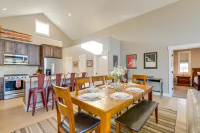 a dining room and kitchen with a table and chairs at 5 Mi to Winter Park Resort Fraser Family Home in Fraser