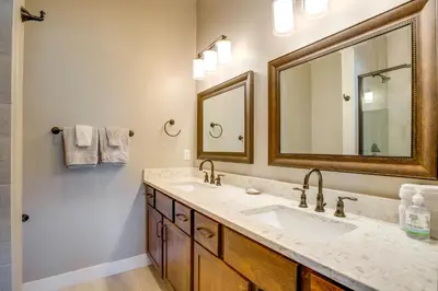 a bathroom with two sinks and a mirror at 5 Mi to Winter Park Resort Fraser Family Home in Fraser