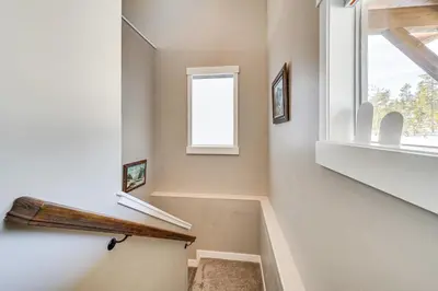 a staircase in a house with a window at 5 Mi to Winter Park Resort Fraser Family Home in Fraser