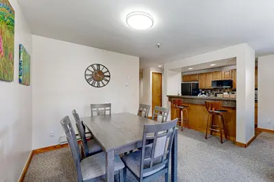a kitchen and dining room with a table and chairs at Mountain View Lakeside Retreat in Dillon