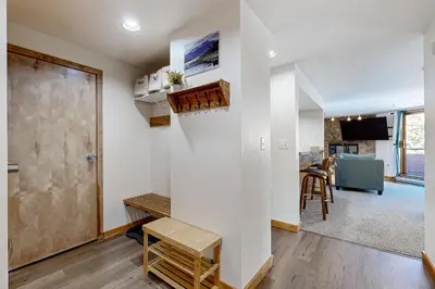 a room with white walls and a door and a table at Mountain View Lakeside Retreat in Dillon