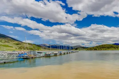 a dock on a lake with boats docked at Mountain View Lakeside Retreat in Dillon