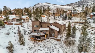 an aerial view of a house in the snow at Dillon Retreat with Lake Views and Private Hot Tub in Dillon