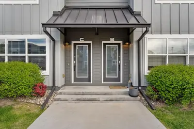 a front door of a house with a porch at Old Town Escape with King Bed, Dog-Friendly in Fort Collins