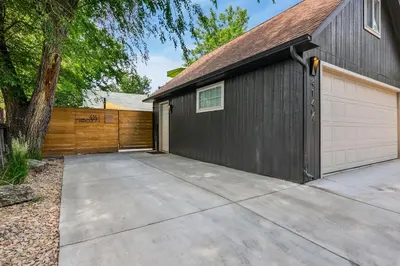 a house with a garage and a driveway at Chic Luxury Retreat in Old Town, Walk Everywhere! in Fort Collins