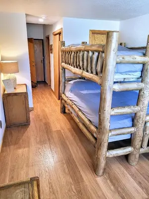 a bedroom with two bunk beds in a room at Best Location in Downtown Winter Park in Winter Park