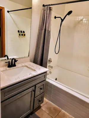 a bathroom with a sink and a shower at Best Location in Downtown Winter Park in Winter Park