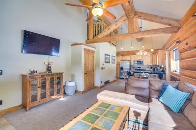a living room with a couch and a ceiling fan at Close to RMNP and Beach Grand Lake Cabin Retreat! in Grand Lake