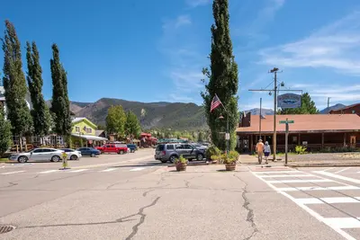 a street with cars parked in a parking lot at Close to RMNP and Beach Grand Lake Cabin Retreat! in Grand Lake