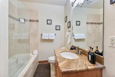 a bathroom with a sink and a tub and a toilet at Cozy 3BR Keystone Escape with Fireplace and Hot Tub in Keystone