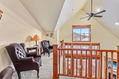 a living room with chairs and a ceiling fan at Cozy 3BR Keystone Escape with Fireplace and Hot Tub in Keystone