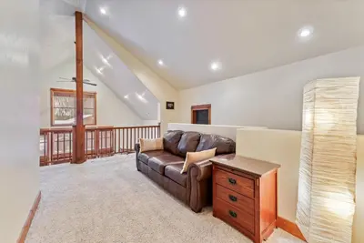 a living room with a couch and a table at Cozy 3BR Keystone Escape with Fireplace and Hot Tub in Keystone