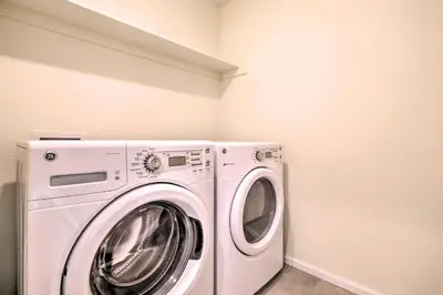 a white washer and dryer in a laundry room at Charming 3BR Retreat - Perfect for Families! in Fort Collins