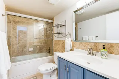 a bathroom with a sink and a toilet and a shower at 5 Mi to Winter Park Resort Unit with Pool and Hot Tub in Fraser
