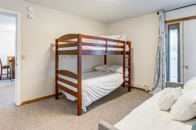 a bedroom with two bunk beds in a room at 5 Mi to Winter Park Resort Unit with Pool and Hot Tub in Fraser