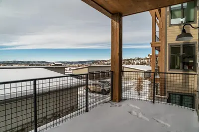 a balcony with a view of a city at Elevated Vibes in Fraser