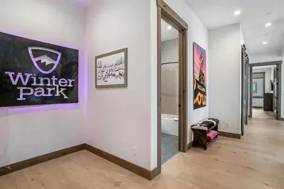 a hallway with a wall with a sign that reads winter park at Elevated Vibes in Fraser