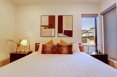 a bedroom with a bed and a large window at River West 611 condo in Silverthorne