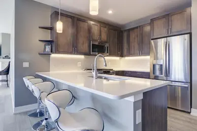 a kitchen with a sink and a counter with stools at Sail Lofts 205 condo in Dillon