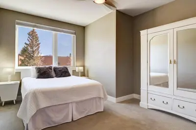 a bedroom with a bed and a large window at Sail Lofts 205 condo in Dillon