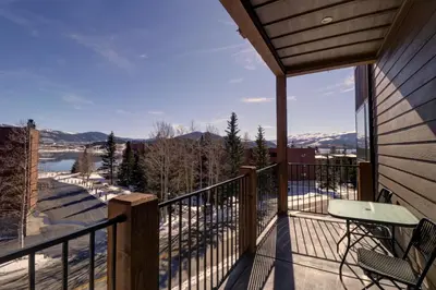 a balcony with a table and chairs and a view at Sail Lofts 205 condo in Dillon
