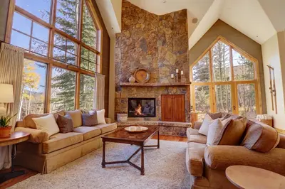 a living room with two couches and a fireplace at Peakside Escape 178 home in Silverthorne
