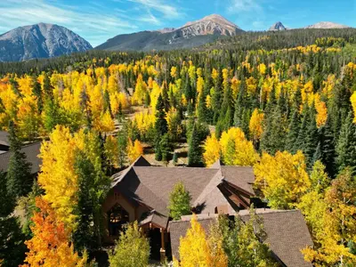 an autumn view of a house in the mountains at Peakside Escape 178 home in Silverthorne